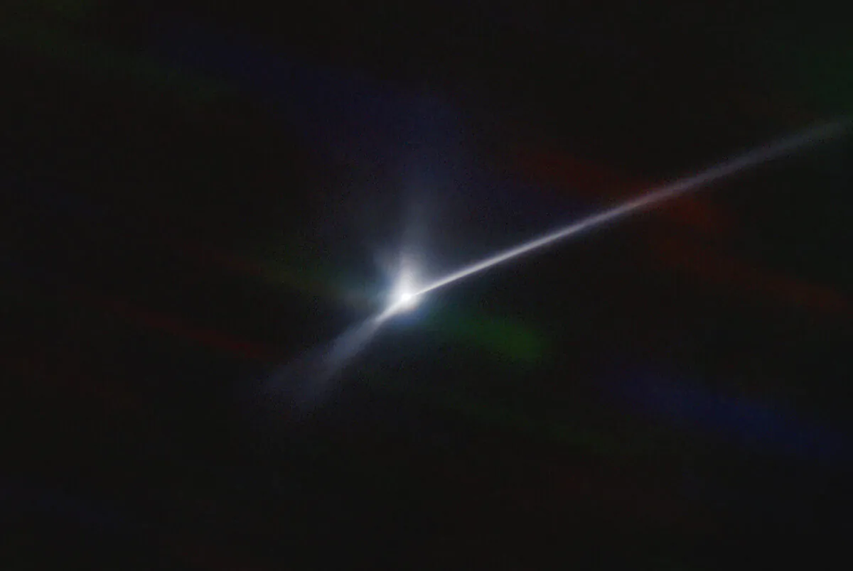 A plume of dust and debris blasted from the surface of the asteroid Dimorphos by NASA's DART spacecraft after it impacted on Sept. 26, 2022, captured by the U.S. National Science Foundation's NOIRLab's SOAR telescope in Chile. (Teddy Kareta, Matthew Knight/NOIRLab via AP)