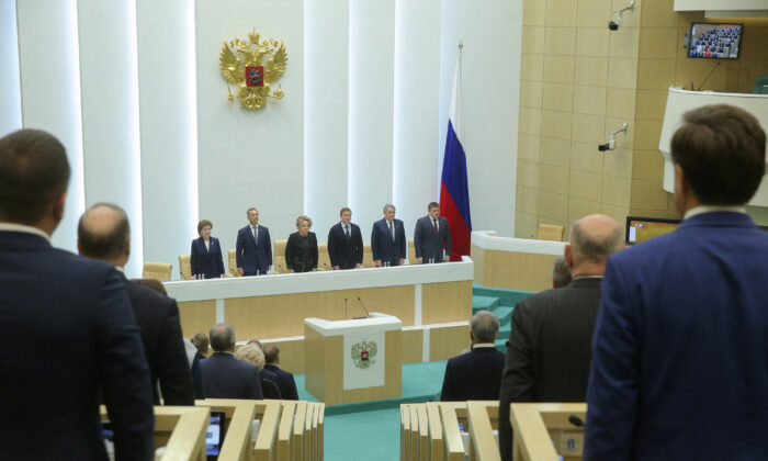 Members of the Council of the Russian Federation, the upper house of parliament, attend a session to ratify the law to annex the Donetsk, Kherson, Luhansk and Zaporizhia regions of Ukraine to Russia on October 4, 2022 in Moscow.  (Council of the Russian Federation/handout Reuters)