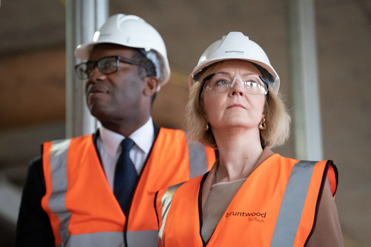 Prime Minister Liz Truss and Chancellor of the Exchequer Kwasi Kwarteng during a visit to a construction site for a medical innovation campus in Birmingham, on Oct. 4, 2022. (Stefan Rousseau/PA Media)