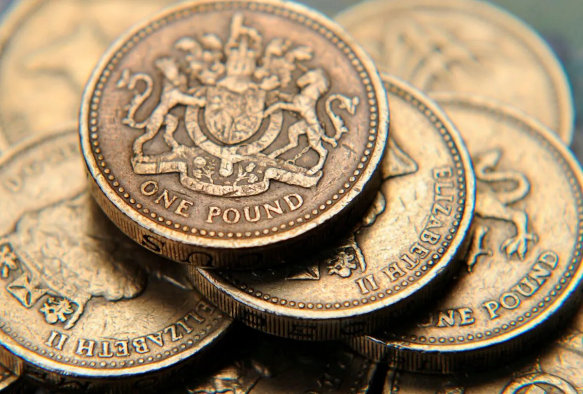 A pile of one pound coins is seen in a photo illustration. (Toby Melville/Illustration/Reuters)
