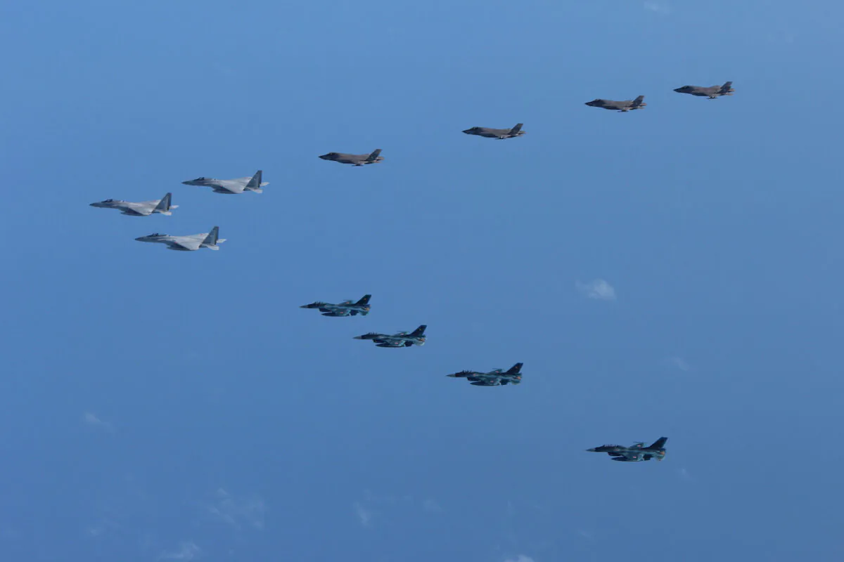 The 5th and 8th Air Wing of Japan Air Self-Defense Force's F-15 and F-2 fighters hold a joint military drill with U.S. Marine Aircraft Group 12's F-35B fighters off Japan's southernmost main island of Kyushu in this handout picture released Oct. 4, 2022. (Joint Staff Office of the Defense Ministry of Japan/Reuters)