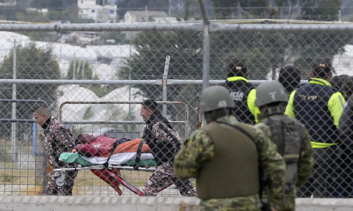 An injured inmate is evacuated in a gurney after a deadly prison riot in Latacunga, Ecuador, on Oct. 4, 2022. (Dolores Ochoa/AP Photo)