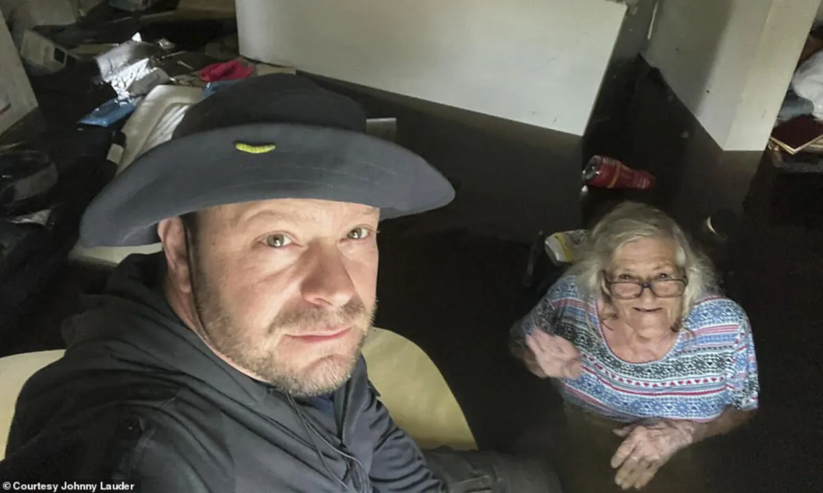 Johnny Lauder takes a selfie with his mother, Karen Lauder, 86, as he came to rescue her after water flooded her home in Naples, Fla., on Sept. 28, 2022, following Hurricane Ian. (Johnny Lauder via AP)