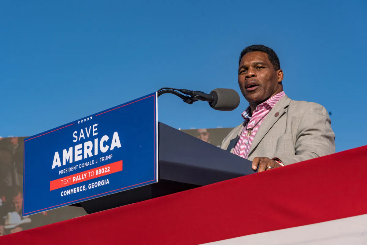 Heisman Trophy winner and Republican candidate for U.S. Senate Herschel Walker speaks to supporters of former U.S. President Donald Trump during a rally at the Banks County Dragway in Commerce, Ga., on March 26, 2022. (Megan Varner/Getty Images)