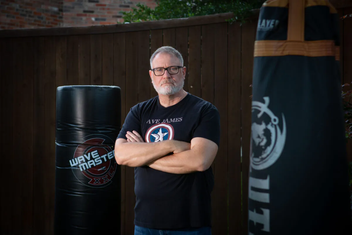 Jeff Younger stands in the backyard of his home Sept. 16 2022 where he used to box with his sons. (Bobby Sanchez for The Epoch Times)