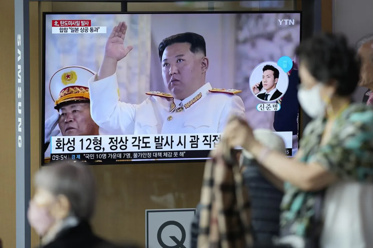 A TV screen showing a news program reporting about North Korea's missile launch with file footage of North Korean leader Kim Jong Un, at the Seoul Railway Station in Seoul, South Korea, on Oct. 4, 2022. (Lee Jin-man/AP Photo)
