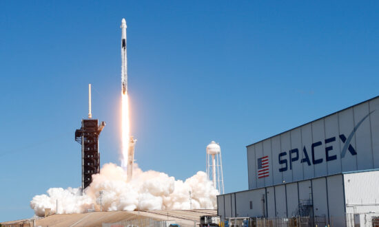 SpaceX Capsule Heads to Space Station Ferrying NASA Crew and Russian