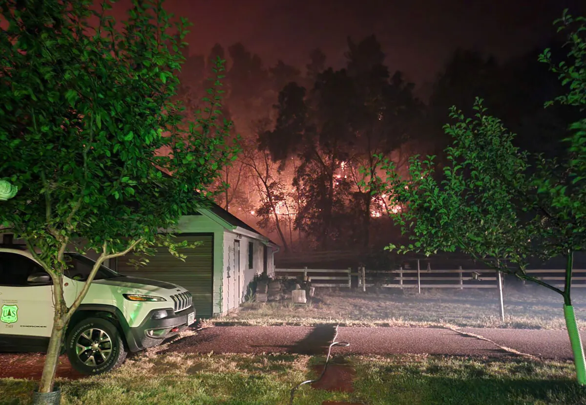 Distant flames from the Bovee Fire near the Bessey Ranger District of the Nebraska National Forest on Oct. 3, 2022. (Julie Bain/Nebraska National Forest & Grasslands Service via AP)