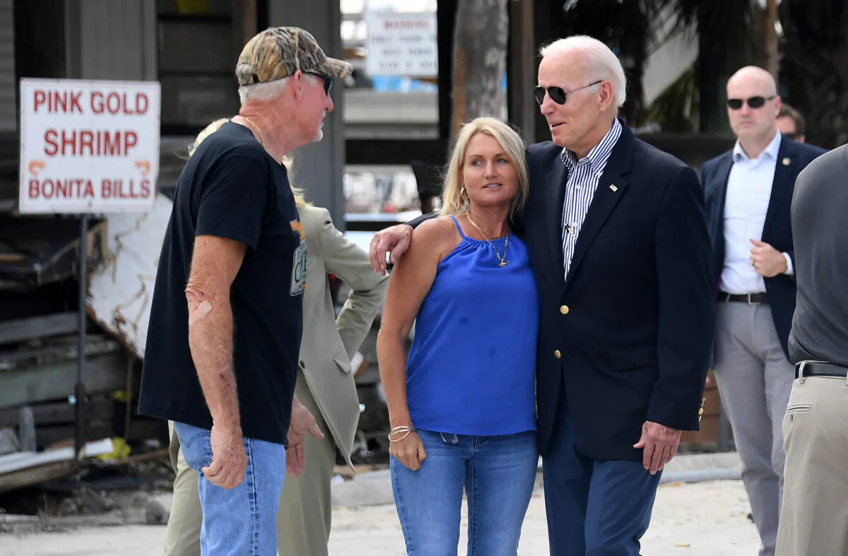 President Joe Biden meets with local residents impacted by Hurricane Ian in Fort Myers, Fla., on Oct. 5, 2022. (Olivier Douliery/AFP via Getty Images)