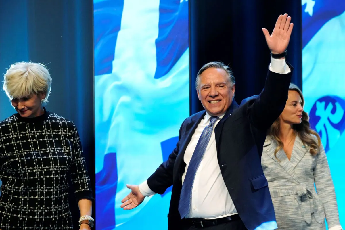 CAQ Leader Francois Legault arrives on stage to make his victory speech to supporters at his party's election night headquarters in Quebec City on Oct. 3, 2022. (The Canadian Press/Paul Chiasson)