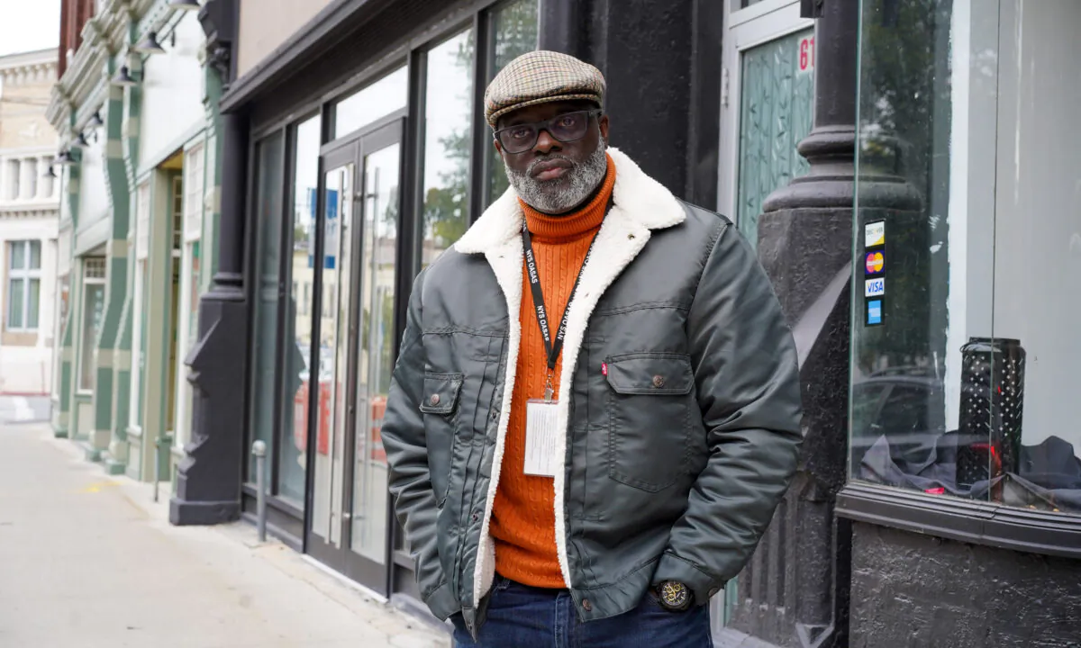 Mitchell Williams stands in front of his event space store front on North Street in downtown Middletown, N.Y., on Oct. 3, 2022. (Cara Ding/The Epoch Times)