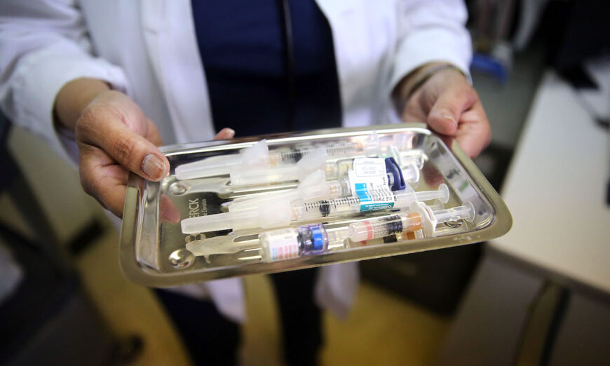 A nurse holds out a tray of immunizations in Newark, New Jersey, on Aug. 28, 2013. (Spencer Platt/Getty Images)