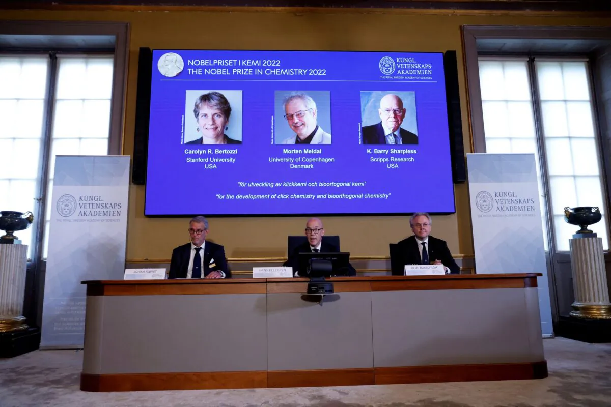 (L–R) Chairman of the Nobel Committee for Chemistry Jonas Aqvist, Secretary General of the Royal Swedish Academy of Sciences Hans Ellegren, and member of the Nobel Committee for Chemistry Olof Ramstrom announce winners of the 2022 Nobel Prize in Chemistry during a news conference at The Royal Swedish Academy of Sciences in Stockholm on Oct. 5, 2022. (TT News Agency/Christine Olsson via Reuters)