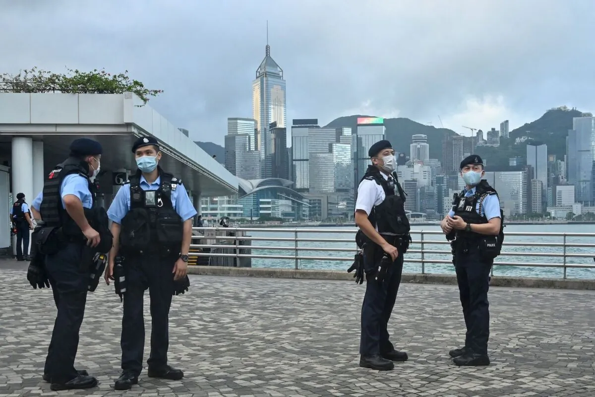Police keep watch in Hong Kong on Oct. 1, 2022, during commemorations for China's National Day. The day marked the 73rd founding anniversary of the People's Republic of China by the Chinese Communist Party. (Peter Parks/AFP via Getty Images)