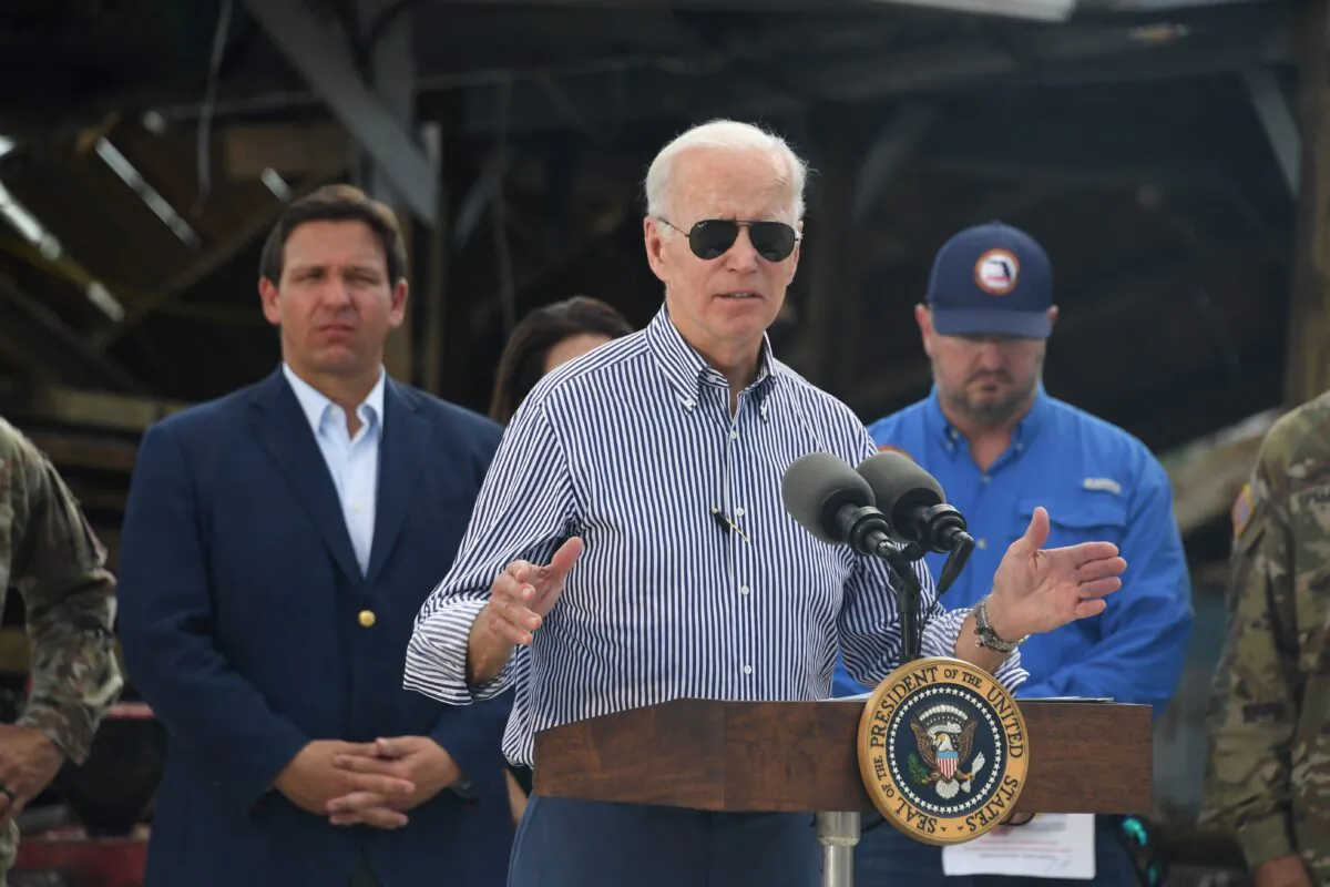 U.S. President Joe Biden speaks in a neighborhood impacted by Hurricane Ian at Fishermans Pass in Fort Myers, Florida, on Oct. 5, 2022. (Olivier Douliery/AFP via Getty Images)