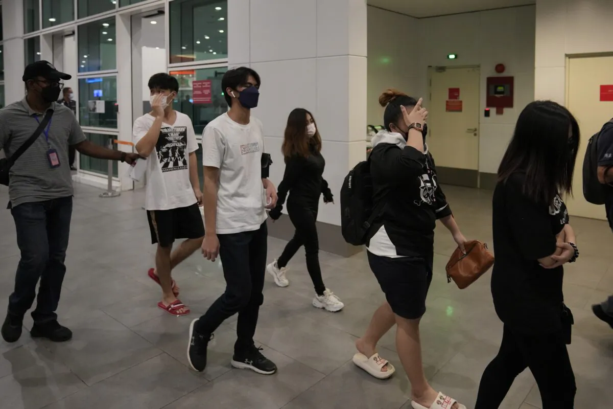 Malaysian youths rescued from human traffickers in Cambodia arrive at the Kuala Lumpur Airport Terminal in Sepang, Malaysia, on Oct. 6, 2022. (Vincent Thian/AP Photo)