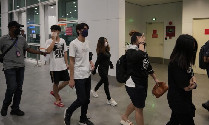 Malaysian youths rescued from quality  traffickers successful  Cambodia get  astatine  the Kuala Lumpur Airport Terminal successful  Sepang, Malaysia, connected  Oct. 6, 2022. (Vincent Thian/AP Photo)