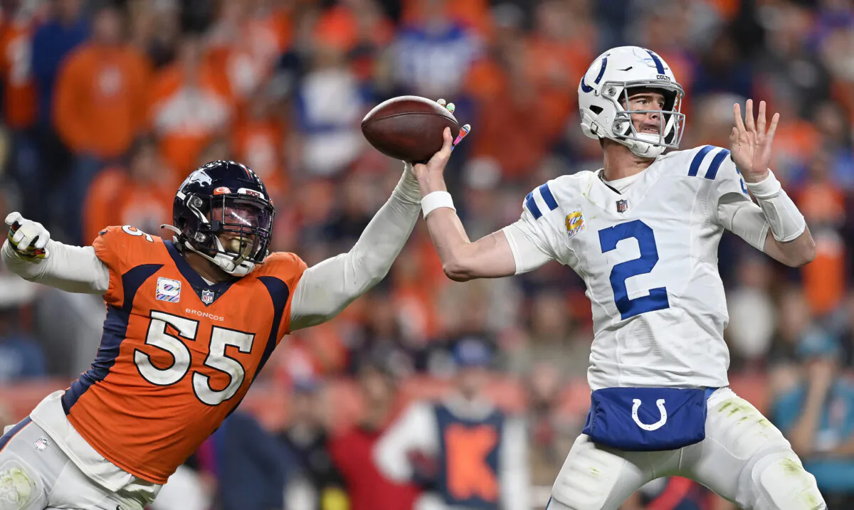 Matt Ryan (2) of the Indianapolis Colts is pressured by Baron Browning (56) of the Denver Broncos during a game at Empower Field At Mile High in Denver, on Oct. 6, 2022. (Dustin Bradford/Getty Images)