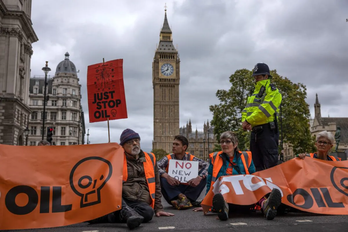 Just Stop Oil protesters block traffic in Parliament Square in London, on Oct. 4, 2022. (Dan Kitwood/Getty Images)