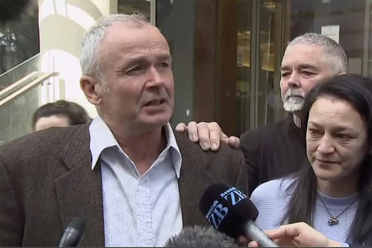 Mark Ellis (L), brother of Peter Ellis, speaks to the media outside a court in Wellington, New Zealand, on Oct. 7, 2022, in a still from video. (TVNZ via AP)