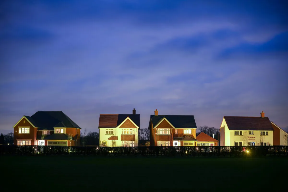 Recently constructed show homes are illuminated for potential buyers on a new housing estate in Knutsford, United Kingdom, on Feb. 3, 2022. (Christopher Furlong/Getty Images)