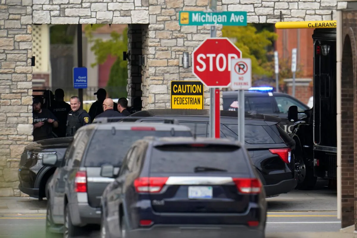 Police work outside the Hampton Inn in Dearborn, Mich., is shown on Oct. 6, 2022. (Paul Sancya/AP Photo)
