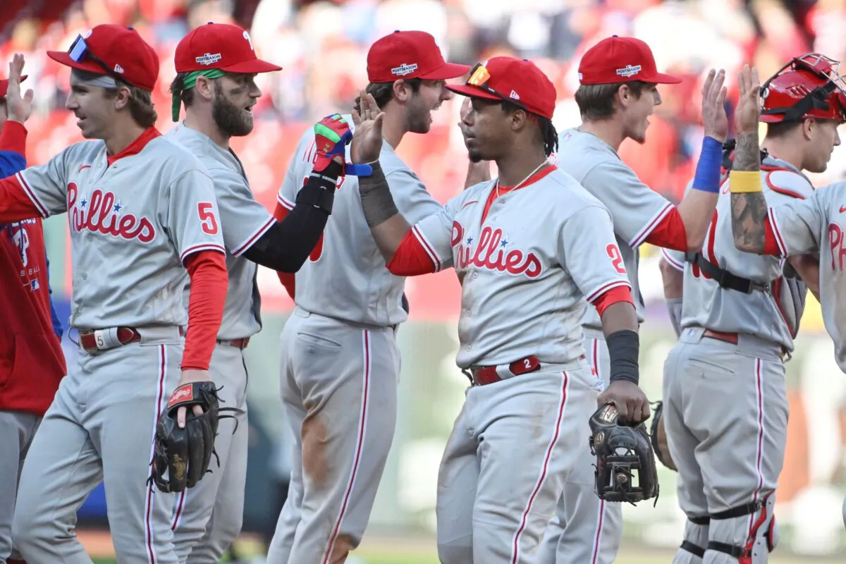 Philadelphia Phillies second baseman Jean Segura (2) celebrates with teammates following their 6–3 victory against the St. Louis Cardinals during game one of the Wild Card series for the 2022 MLB Playoffs at Busch Stadium in St. Louis, Mo., on Oct 7, 2022. (Jeff Curry/USA TODAY Sports via Reuters)