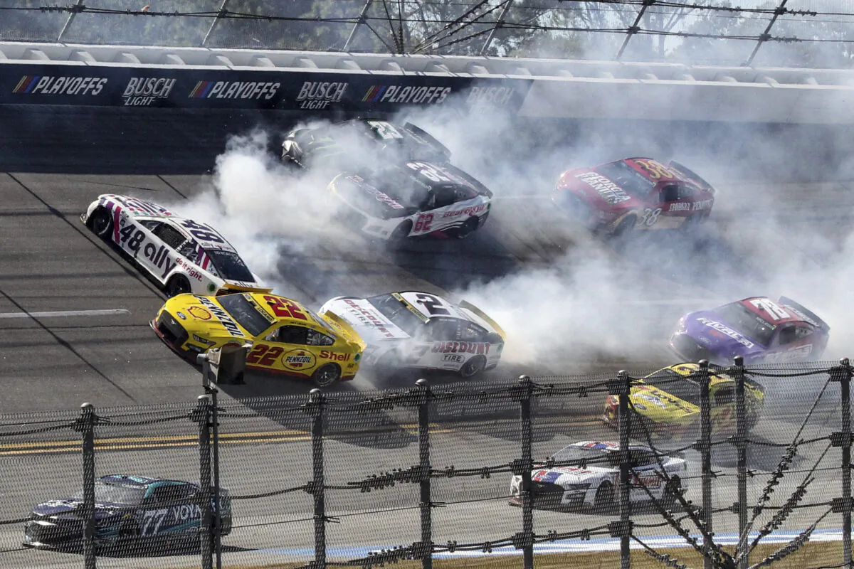 Alex Bowman (48), Joey Logano (22), Austin Cindric (2), Justin Allgaier (62) and Ty Gibbs (23) are involved in a crash in Turn 1 during a NASCAR Cup Series auto race, in Talladega, Ala., on Oct. 2, 2022. (Skip Williams/AP Photo)
