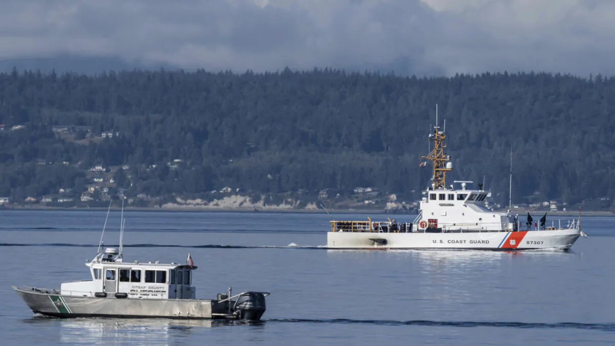 A U.S. Coast Guard boat and Kitsap are seen in this picture, Wash., on Sept. 5, 2022. (Stephen Brashear/AP Photo)