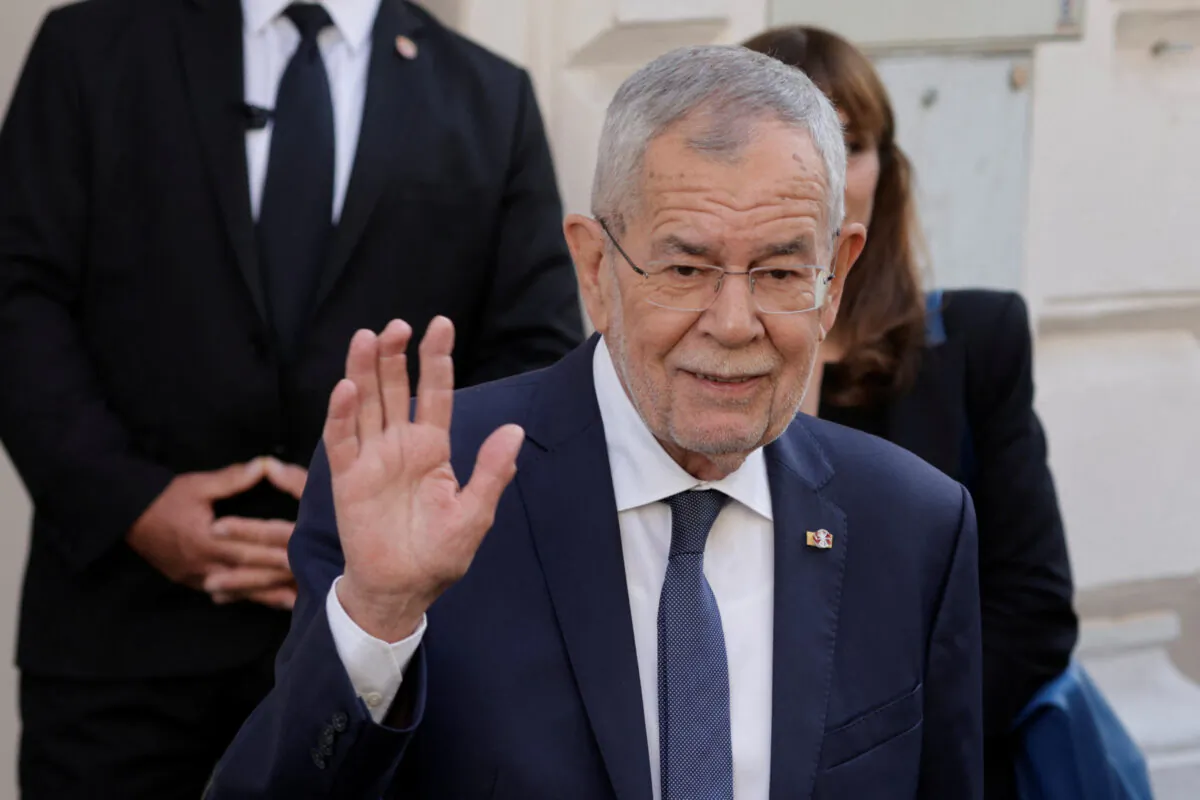 Austrian President Alexander Van der Bellen waves outside the polling station during presidential elections in Vienna, Austria, on Oct. 9, 2022. (Leonhard Foeger/Reuters)