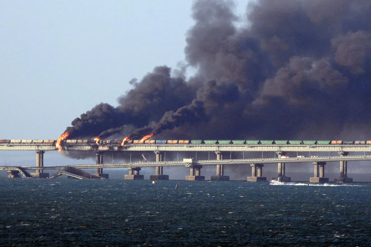 Black smoke billows from a fire on the Kerch bridge that links Crimea to Russia, after a truck exploded, near Kerch, on Oct. 8, 2022. (AFP via Getty Images)