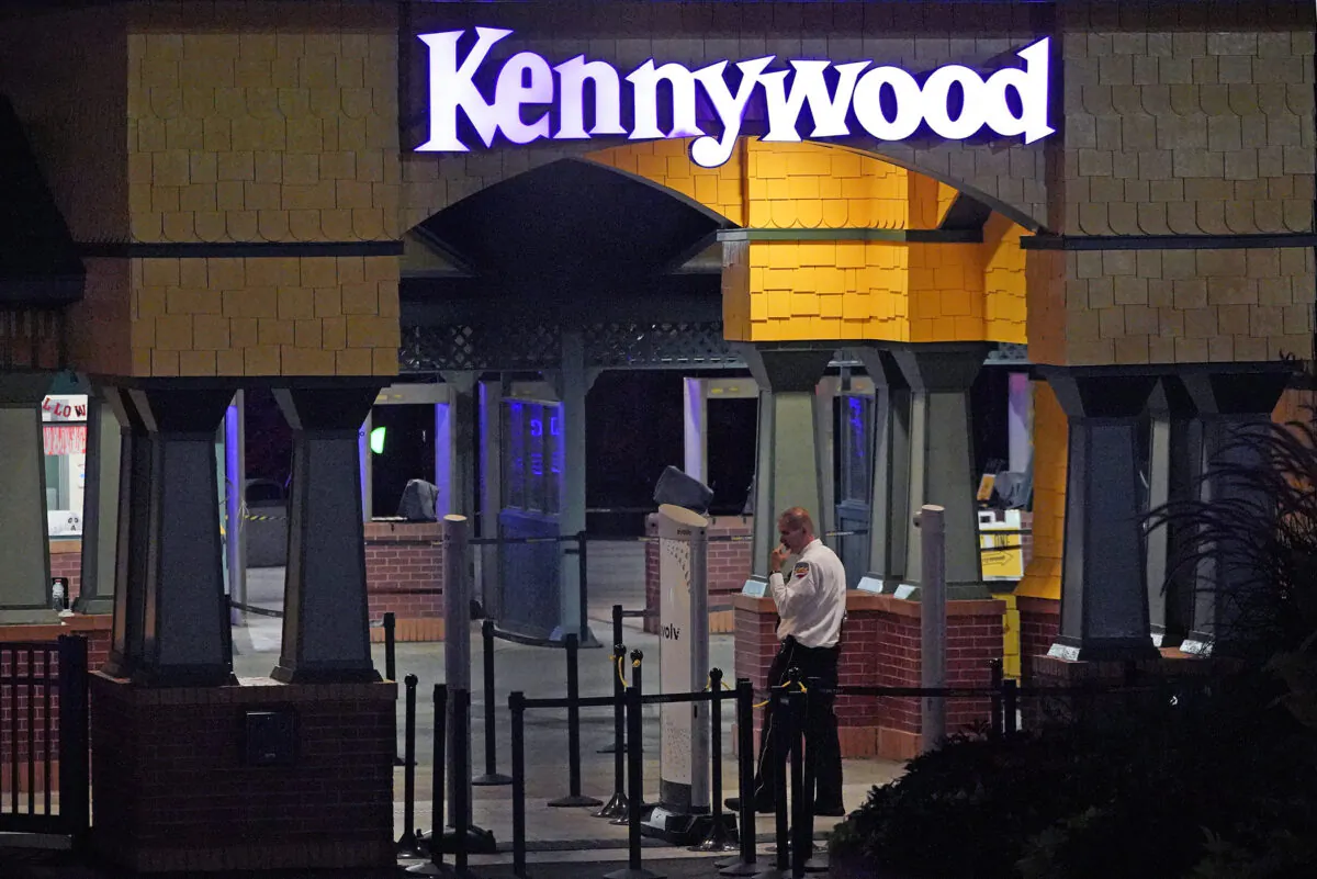 A Kennywood Park security guard stands at the main entrance to the amusement park in West Mifflin, Pa., on Sept. 25, 2022. (Gene J. Puskar/AP Photo)