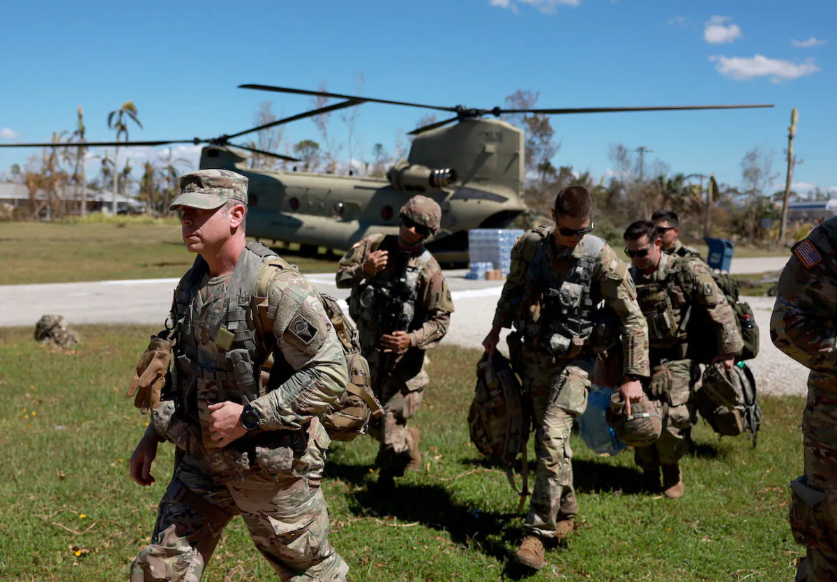 Members of Florida Army National Guard arrive on Pine Island, Fla., on Oct. 2, 2022. (Joe Raedle/Getty Images)