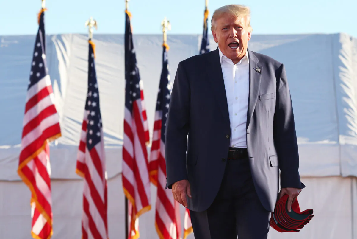 Former President Donald Trump walks to the podium for a campaign rally at Legacy Sports USA in Mesa, Ariz., on Oct. 9, 2022. (Mario Tama/Getty Images)
