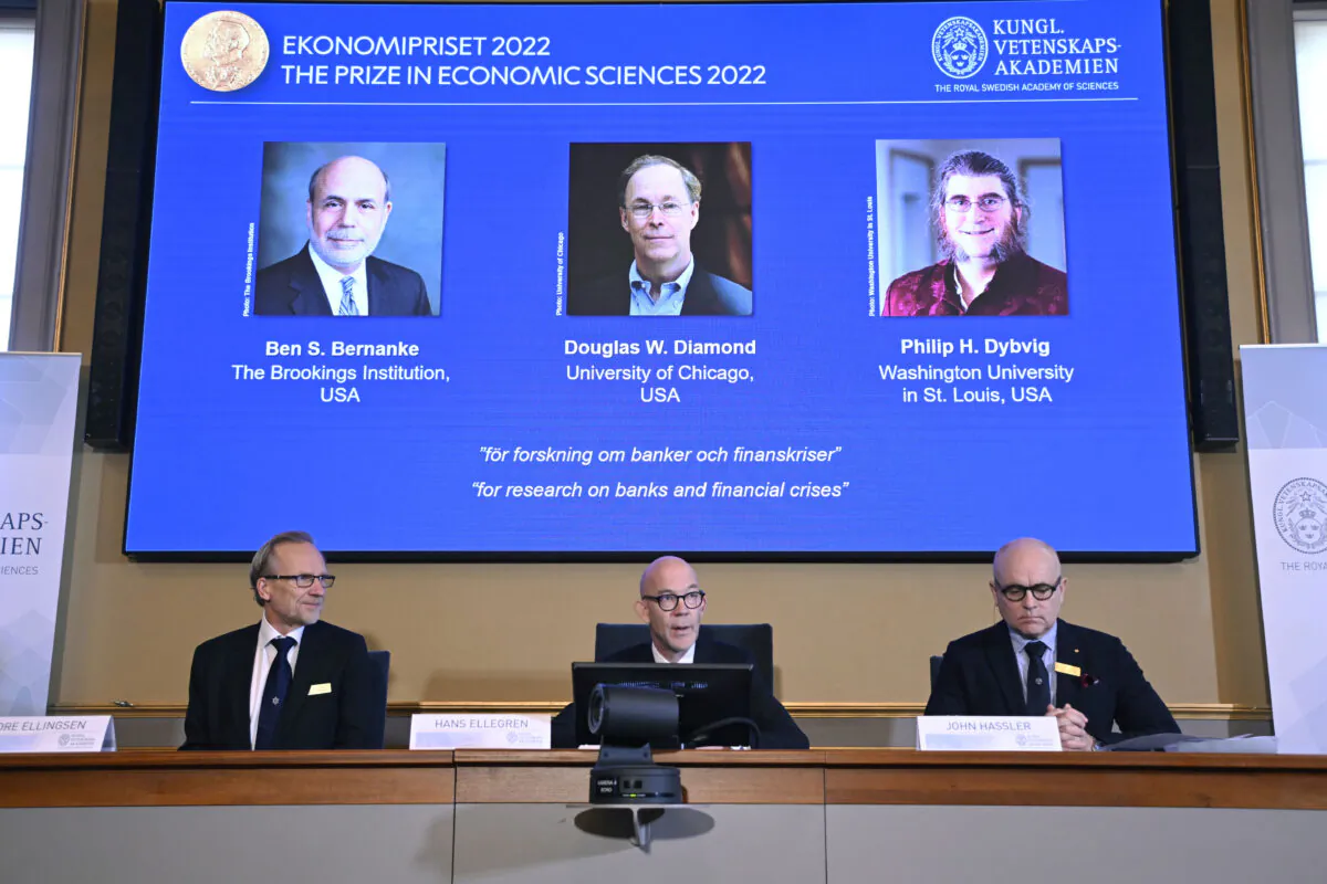(L-R) Members of the Royal Swedish Academy of Sciences Tore Ellingsen, Hans Ellegren, and John Hassler announce the Sveriges Riksbank Prize in Economic Sciences in Memory of Alfred Nobel 2022, during a press conference at the Royal Swedish Academy of Sciences in Stockholm on Oct. 10, 2022. (Anders Wiklund/TT News Agency via AP)