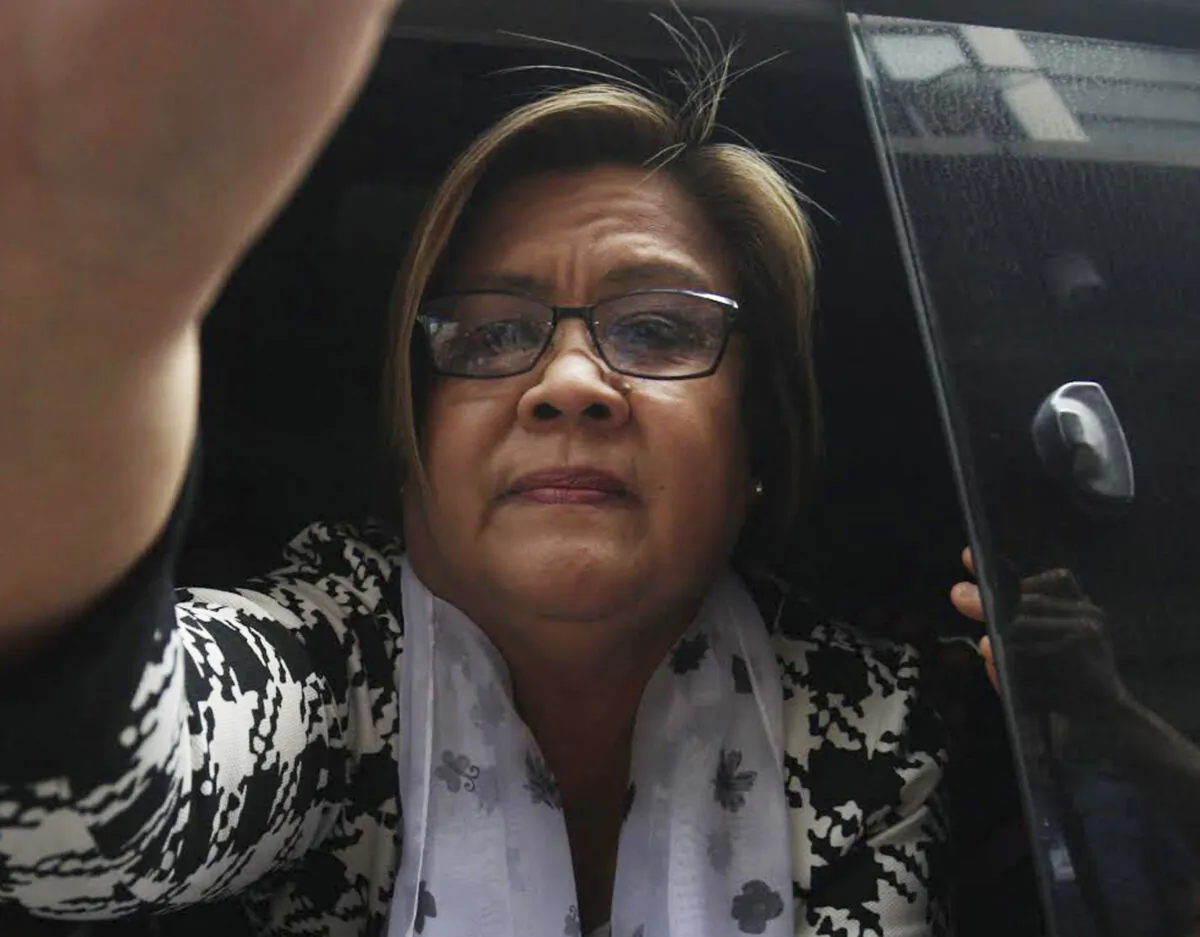 Then-Philippine opposition Senator Leila de Lima arrives at a regional trial court for a brief personal appearance in Paranaque city, southeast of Manila, Philippines, on Feb. 24, 2017. (AP Photo)