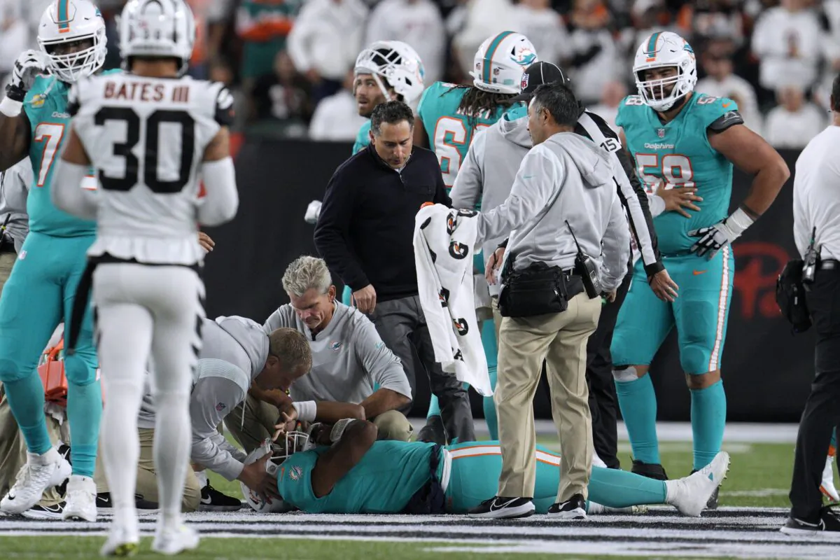 Miami Dolphins quarterback Tua Tagovailoa is examined during the first half of the team's NFL football game against the Cincinnati Bengals in Cincinnati on Sept. 29, 2022. (Jeff Dean/AP Photo)