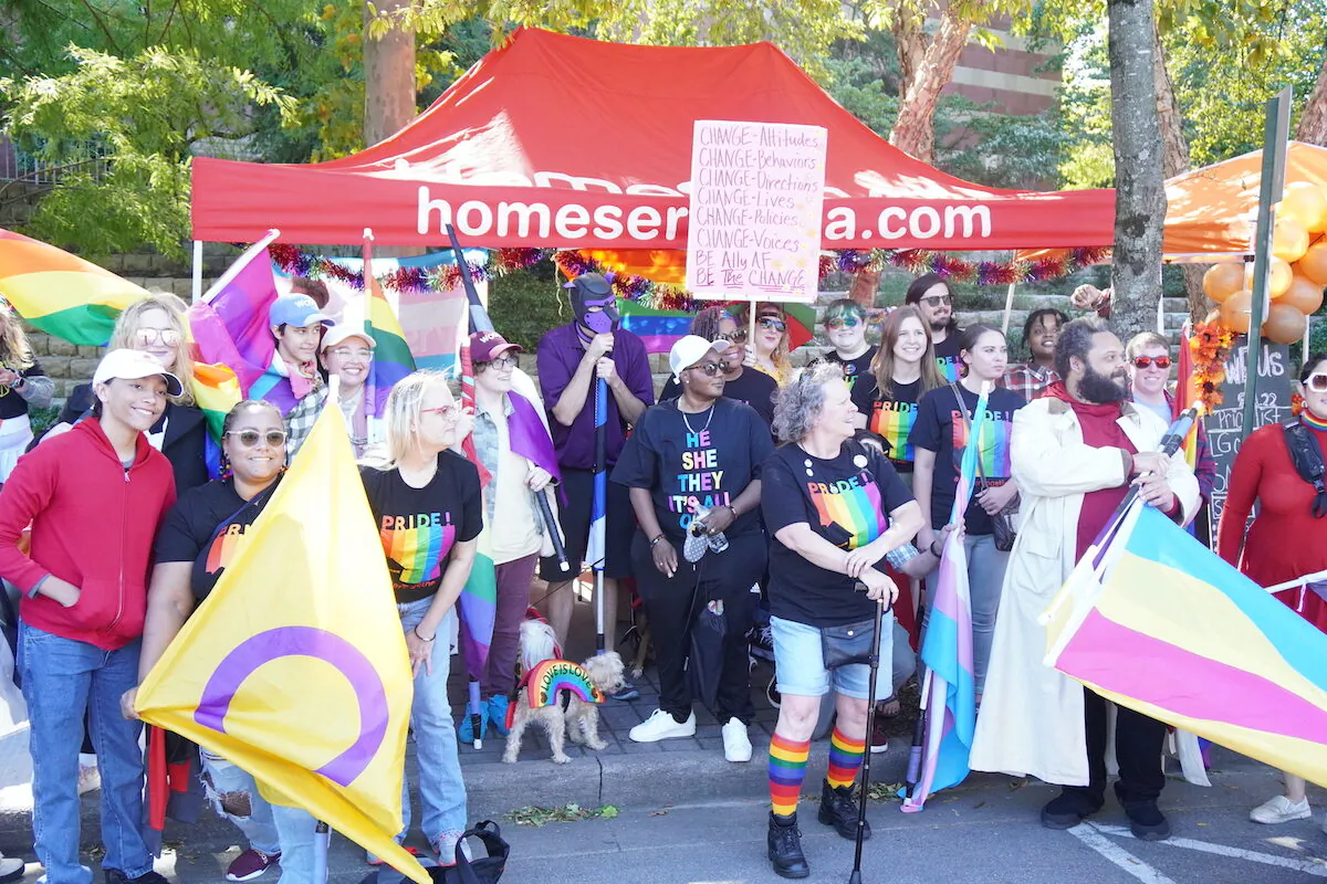 Young adults attend the Chattanooga Pride parade and held drag shows for children in Chattanooga, Tenn., on Oct. 2, 2022. (Jackson Elliott/The Epoch Times)