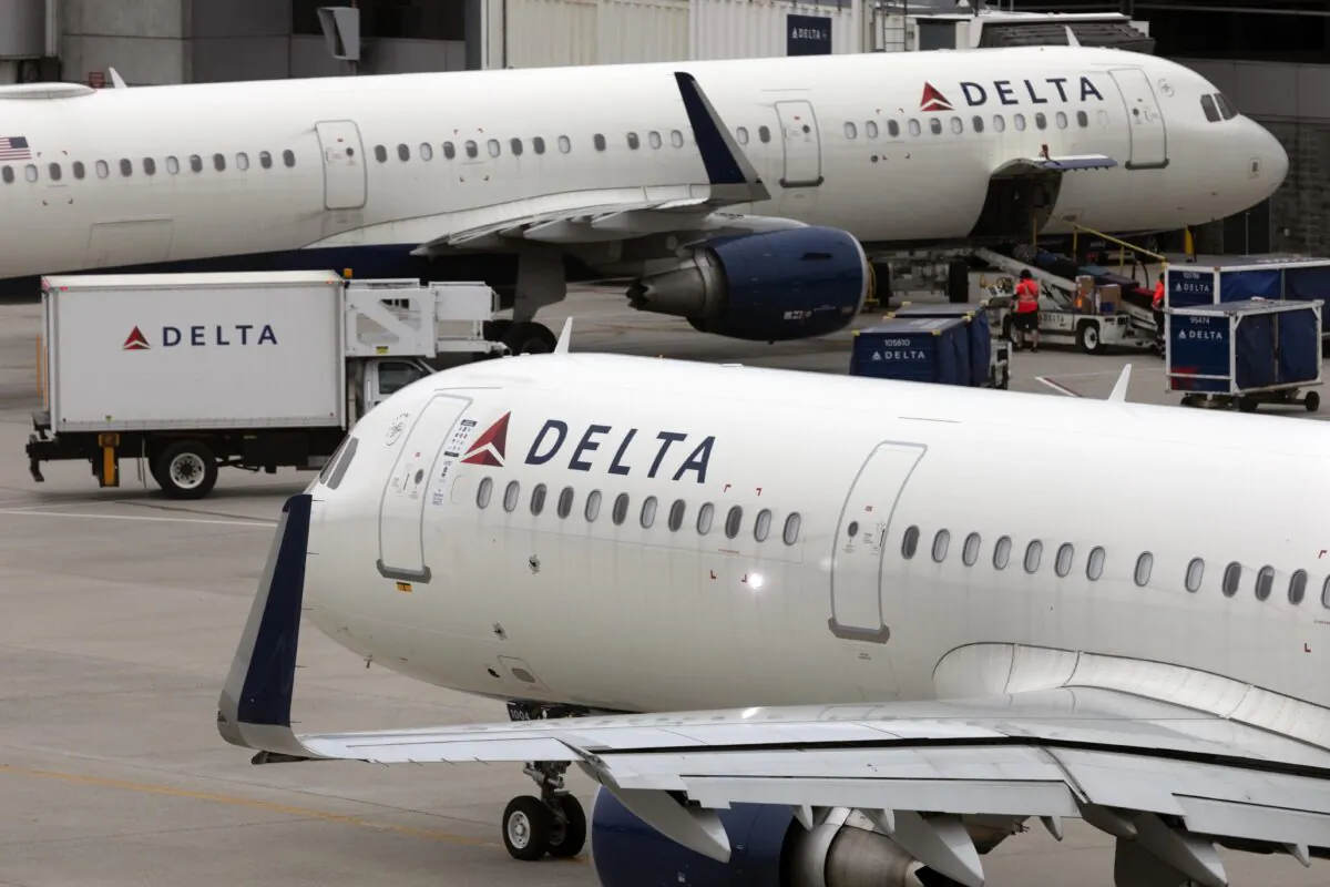 A Delta Air Lines plane leaves the gate at Logan International Airport in Boston on July 12, 2021. (Michael Dwyer/AP Photo)
