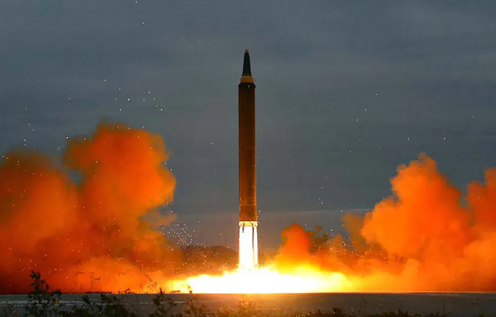 A launch of the Hwasong-12 ballistic missile from an undisclosed location in North Korea on Aug. 29, 2017. (Korean Central News Agency/STR/AFP via Getty Images)