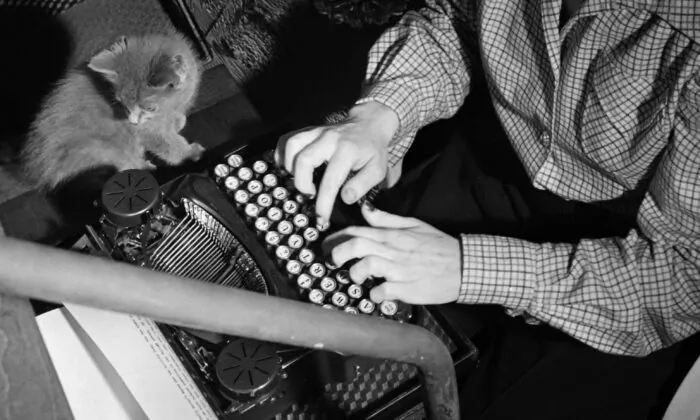 A reporter writes at home with a typewriter in Washington in the late 1940s. (-/AFP via Getty Images)