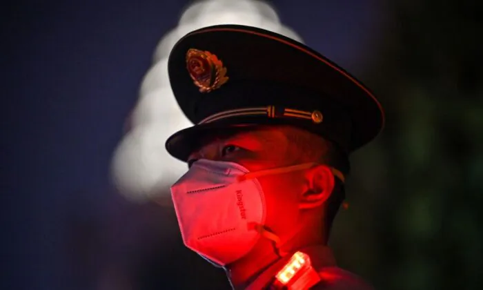 A Chinese paramilitary police officer stands guard on the Bund waterfront during China's National Day celebrations in Shanghai on Oct. 1, 2022. (Hector Retamal/AFP via Getty Images)