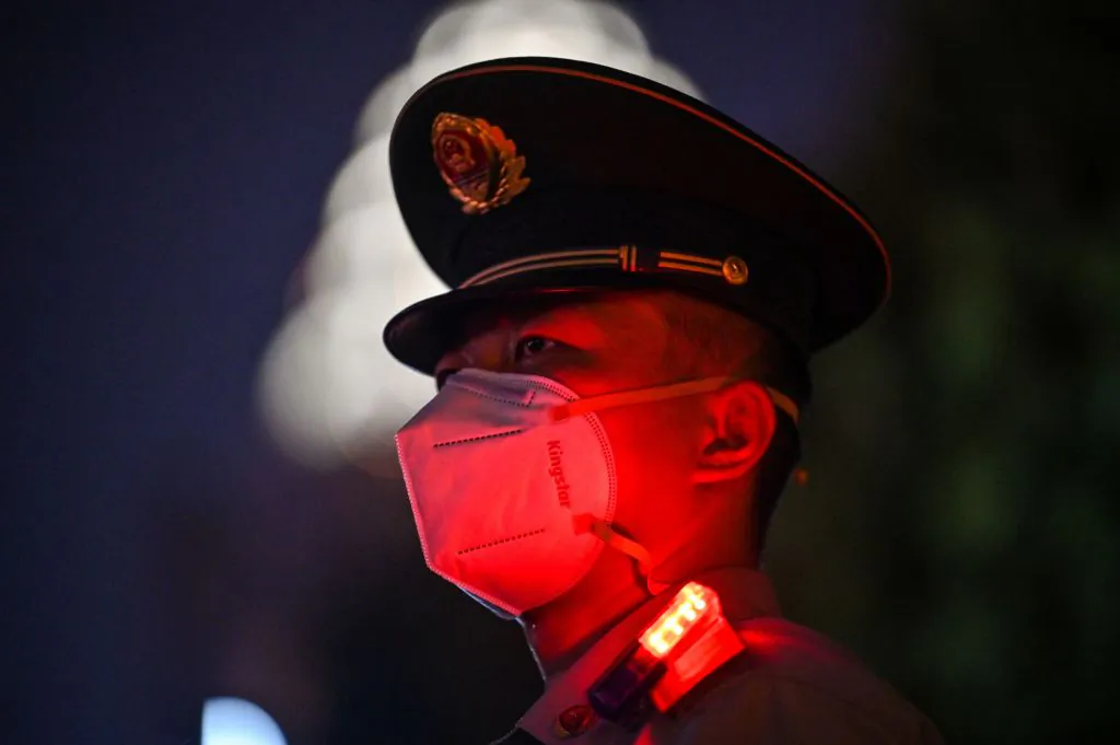 A Chinese paramilitary police officer stands guard on the Bund waterfront during China's National Day celebrations in Shanghai on Oct. 1, 2022. (Hector Retamal/AFP via Getty Images)