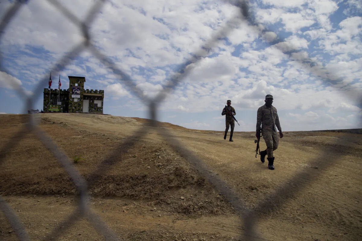 Soldiers patrol the border in Elias Pina, Dominican Republic, on the border with Belladere, Haiti, on March 5, 2021. (Dieu Nalio Chery/AP Photo)