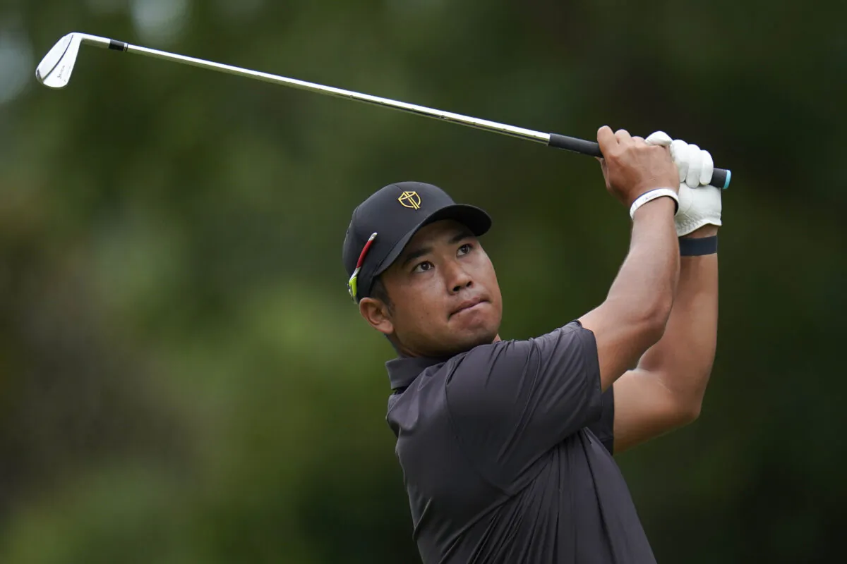 Hideki Matsuyama, of Japan, hits from the sixth tee during their singles match at the Presidents Cup golf tournament at the Quail Hollow Club in Charlotte, N.C., Sept. 25, 2022. (Julio Cortez/AP Photo)