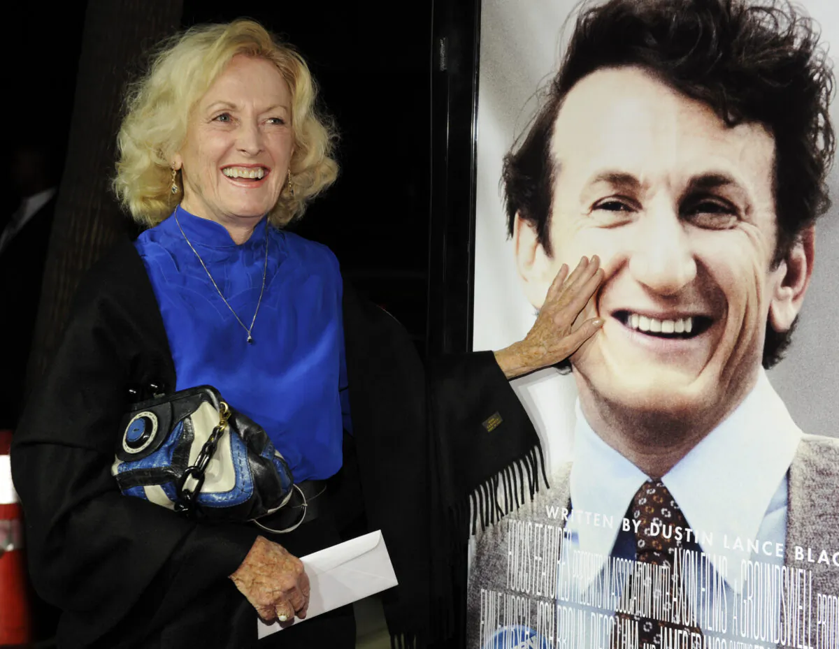 Eileen Ryan, mother of actor Sean Penn, touches her son's image on the poster at the premiere of "Milk" in Beverly Hills, Calif., on Nov. 13, 2008.  (Chris Pizzello/AP Photo)
