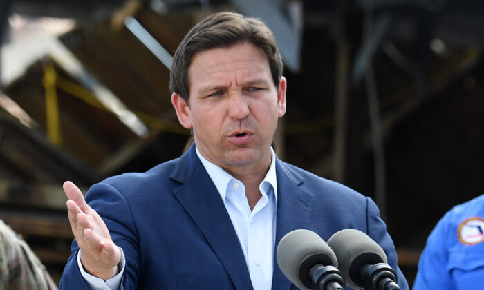Florida Governor Ron DeSantis speaks in a neighborhood impacted by Hurricane Ian at Fisherman's Wharf in Fort Myers, Fla., on Oct. 5, 2022. (Olivier Douliery/AFP via Getty Images)