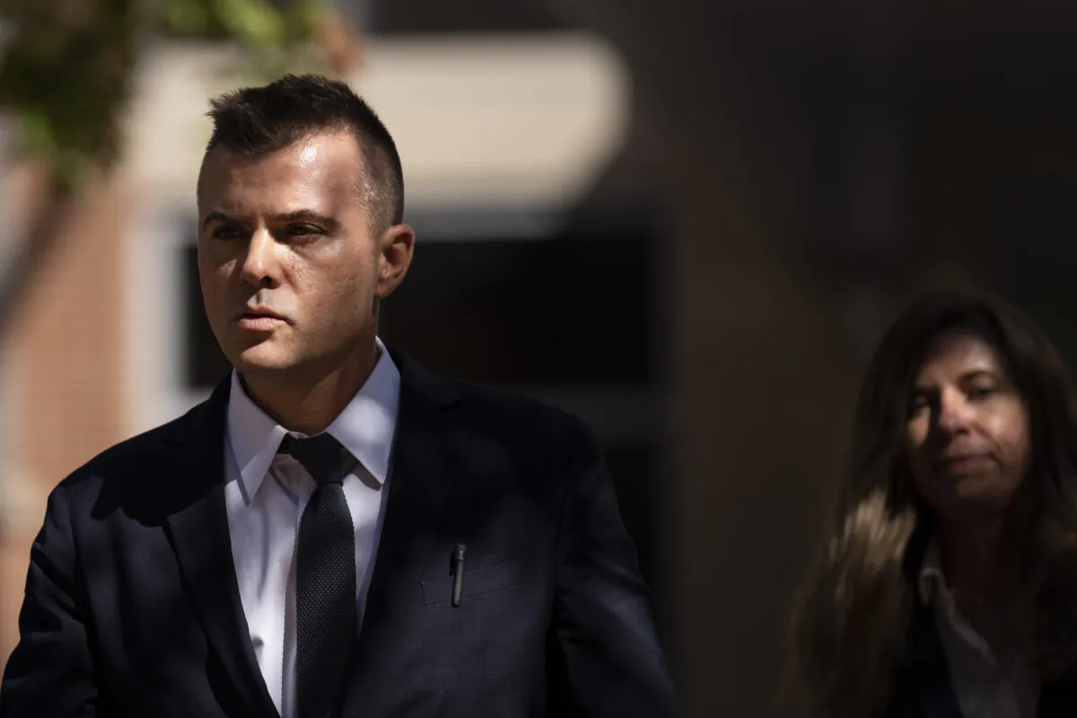 Russian analyst Igor Danchenko walks to the Albert V. Bryan U.S. Courthouse during a break in his trial in Alexandria, Va., on Oct. 11, 2022. (Drew Angerer/Getty Images)