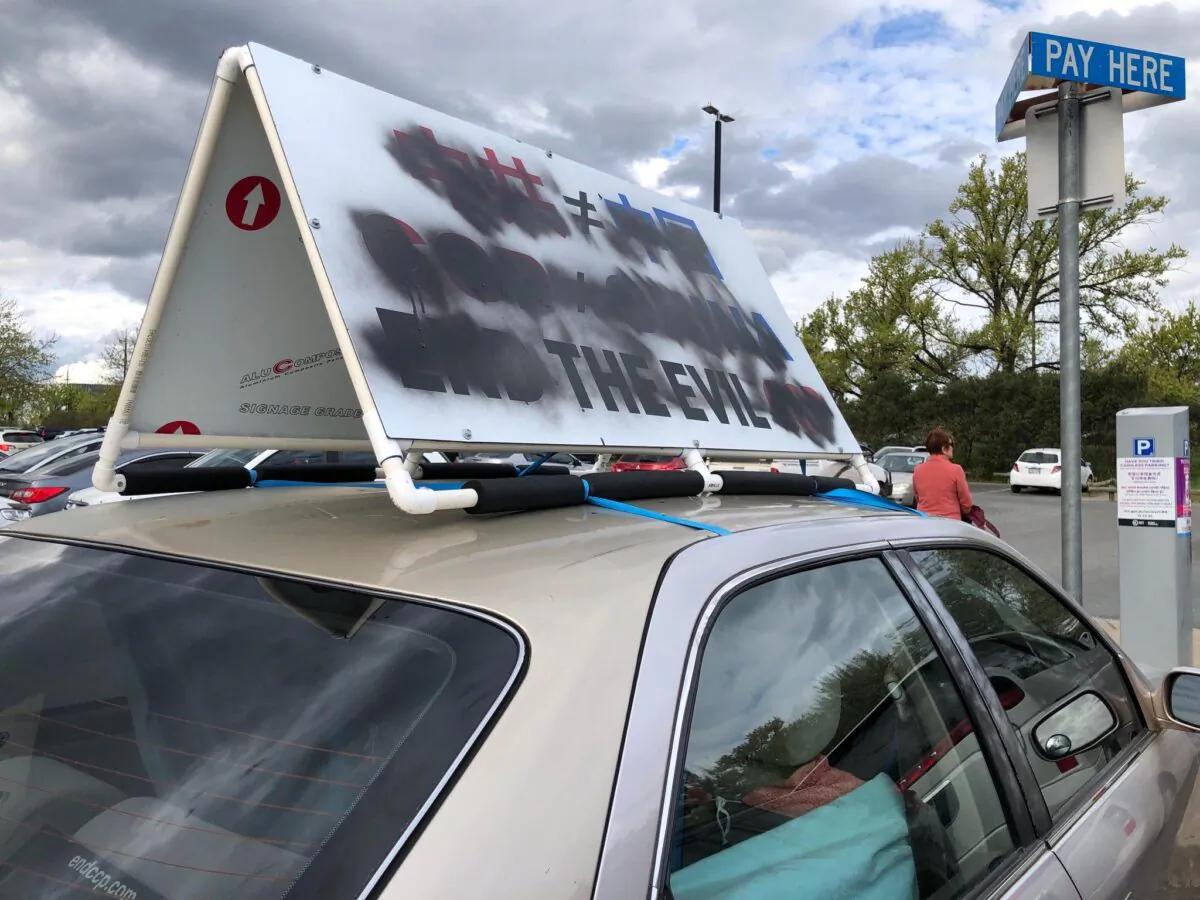 Signage on a car that reads “End the evil CCP (Chinese Communist Party)" was defaced at Floriade car park, Canberra, Australia on Oct. 4.
(Courtesy of Songfa Liu)