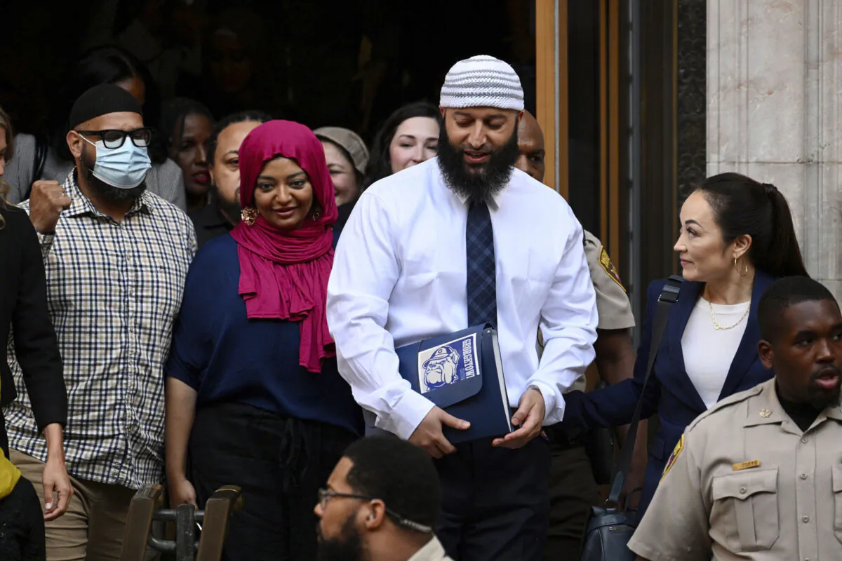 Adnan Syed, (center R), leaves the courthouse after a hearing in Baltimore on Sept. 19, 2022. (Jerry Jackson/The Baltimore Sun via AP)